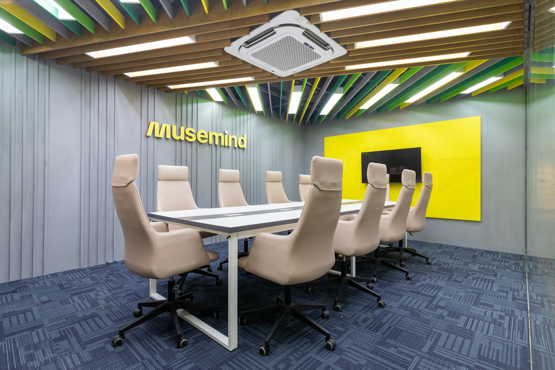 a conference room with a long table and chairs